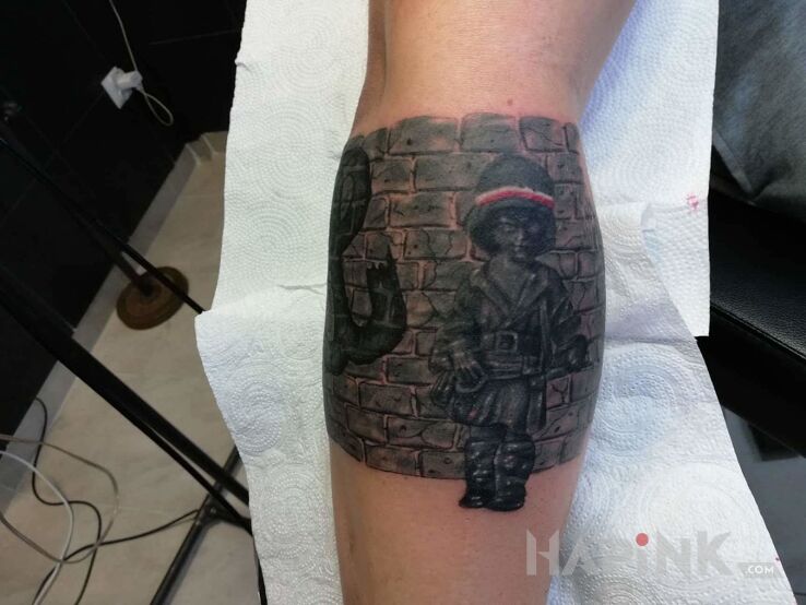 Tattoo Mały powstaniec in patriotic motif on the forearm