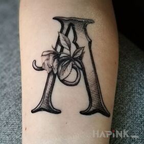 Tattoo LETTER on the forearm motif: lettering