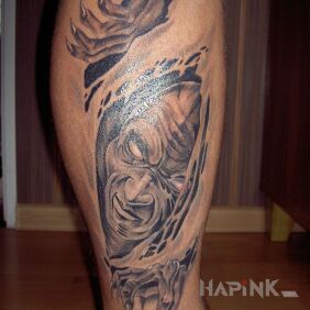 Tattoo DEMON on the calf motif: faces
