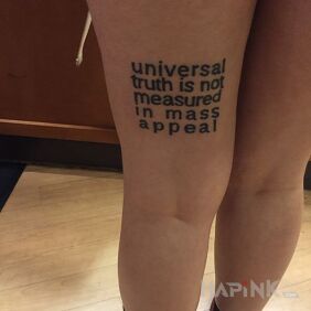 Tattoo The universal truth on the leg motif: lettering