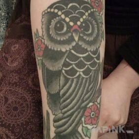 Tattoo Owl color on the forearm style: realistic