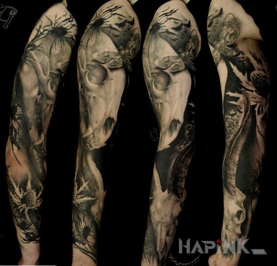 Tattoo Czaszki zwierząt in skulls motif and realistic style on the forearm