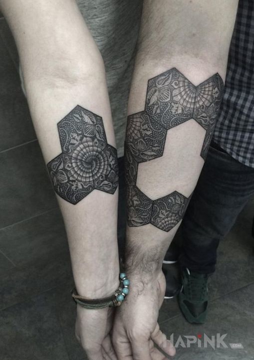 Tattoo Ukladanka in Love motif on the forearm