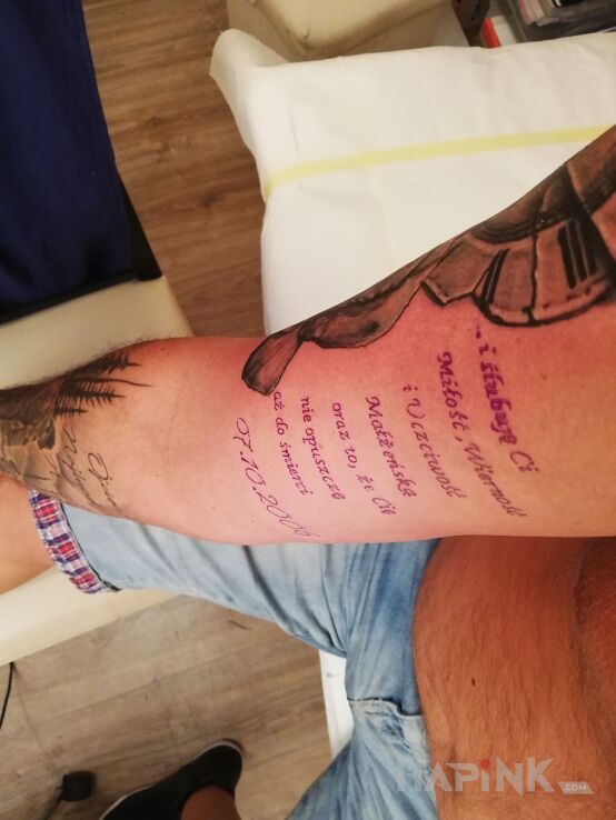Tattoo Rocznica in other motif on the upper arm