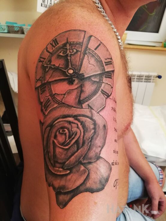 Tattoo Rocznica in other motif on the upper arm