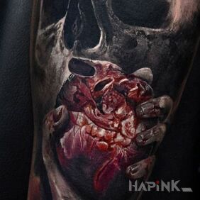 Tattoo Heart on palm on the forearm motif: skulls style: realistic