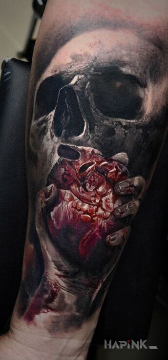 Tattoo Serce na dłoni in skulls motif and realistic style on the forearm