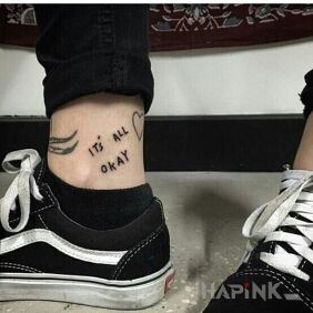Tattoo Okay on the leg motif: lettering
