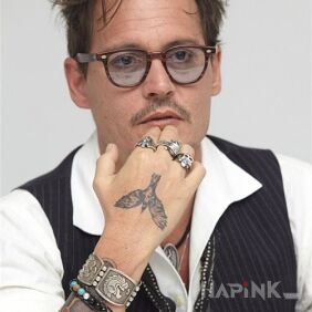 Tattoo Johnny Depp - tattoo of a bird on the hand motif: Johnny Depp