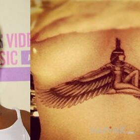 Tattoo Rihanna - tattoo on frame - figure with wings on the chest motif: characters