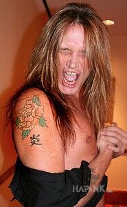 Tattoo Sebastian Bach - kwiatek na ramieniu in Sebastian Bach motif on the upper arm