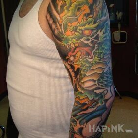 Tattoo Green dragon on the upper arm style: japanese / irezumi