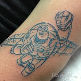 Tattoo Buzz Lightyear on the forearm motif: characters