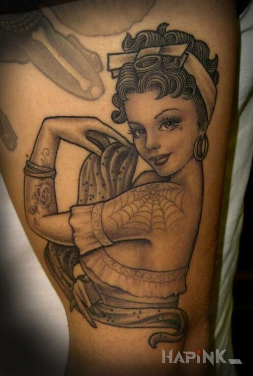 Tattoo Pin up girl in characters motif on the upper arm