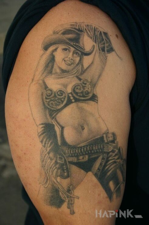 Tattoo Cowwoman :) in characters motif on the upper arm
