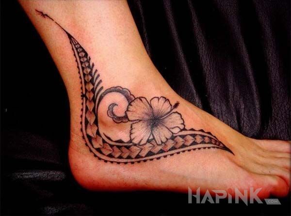 Tattoo Kwiatek in flowers motif and Polynesian style on the foot