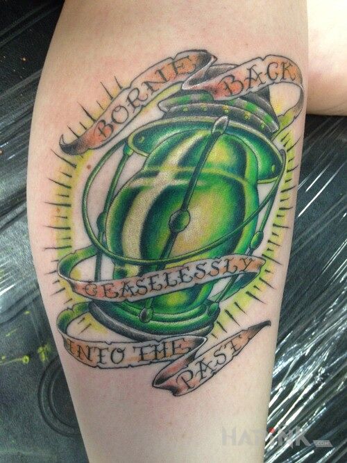 Tattoo Zielona latarnia in lettering motif on the forearm