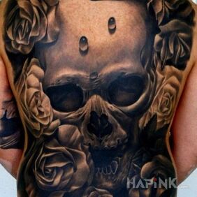 Tattoo Amazing skull accompanied by roses on the back motif: flowers