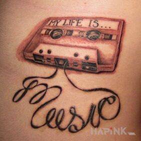 Tattoo My life is music on the chest motif: lettering