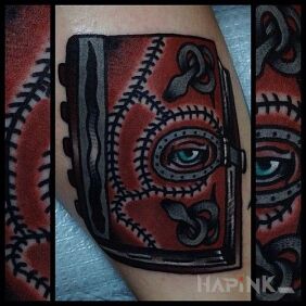 Tattoo Infernal book on the forearm motif: objects