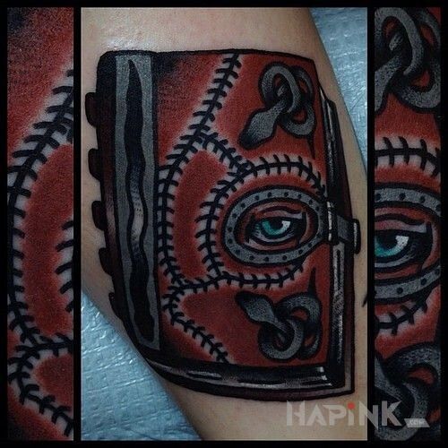Tattoo Piekielna księga in objects motif on the forearm