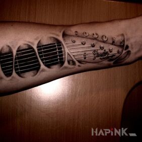 Tattoo Guitar on the forearm motif: objects
