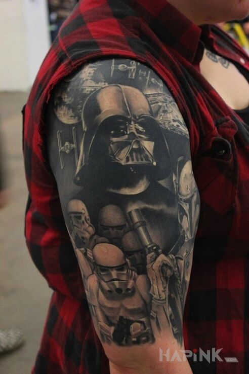 Tattoo Darth Vader in characters motif on the upper arm