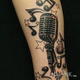 Tattoo Musical composition on the calf motif: other