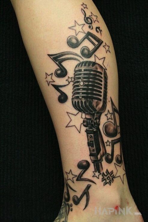 Tattoo Muzyczna kompozycja in other motif on the calf