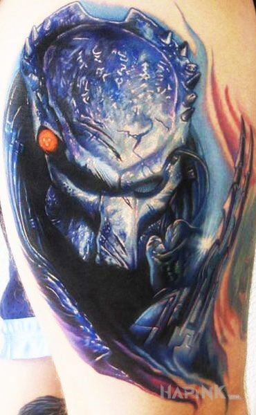 Tattoo Predator in characters motif on the upper arm