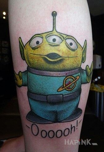 Tattoo Ufoludek  toy story in characters motif on the forearm