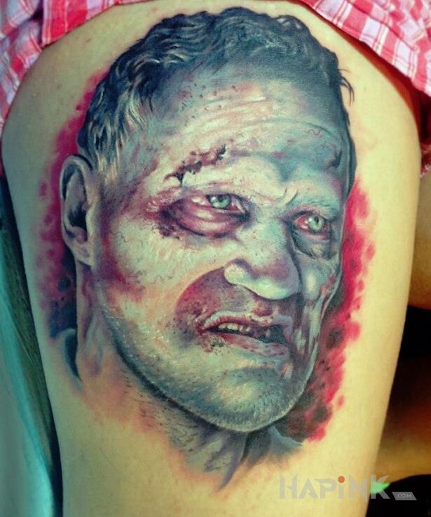 Tattoo Zombie z the walking dead in faces motif on the leg