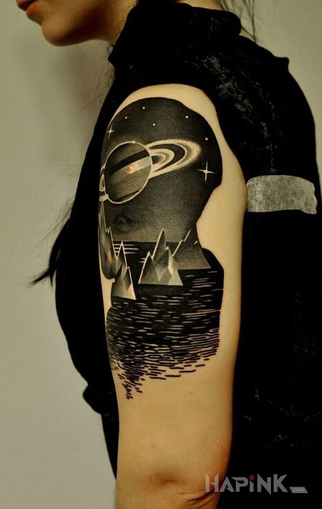 Tattoo Planeta in other motif on the upper arm