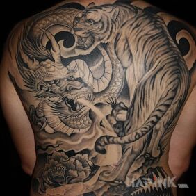 Tattoo Crouching tiger, hidden dragon on the back style: japanese / irezumi