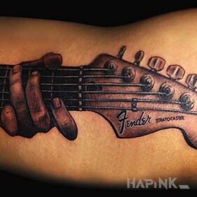 Tattoo Guitar playing on the upper arm motif: other