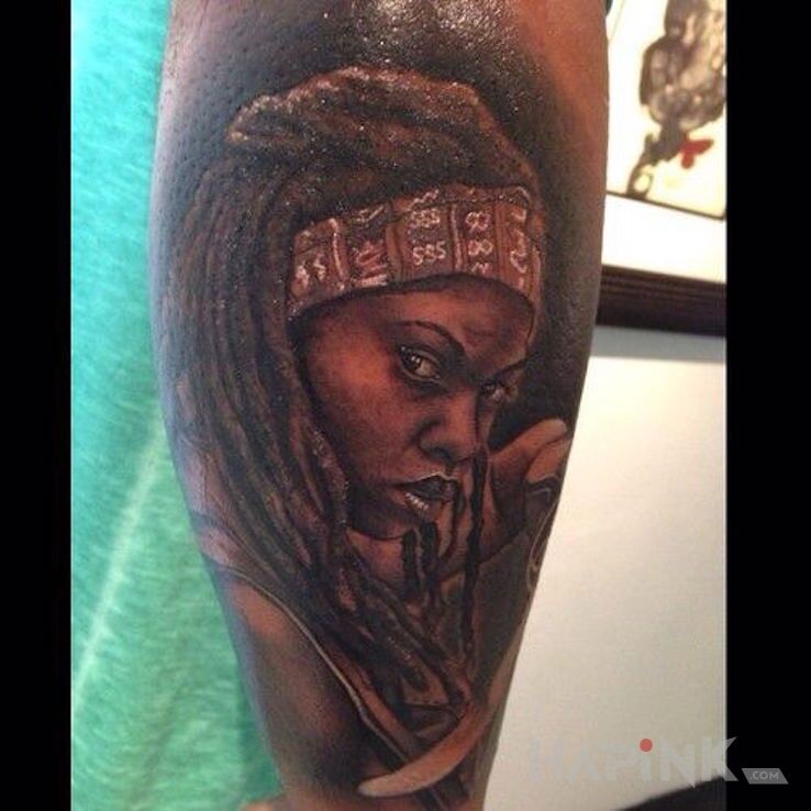 Tattoo Michone in faces motif on the forearm