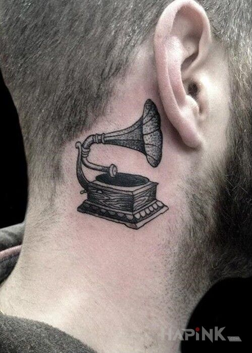 Tattoo Gramofon in objects motif and graphic / illustrative style behind the ear