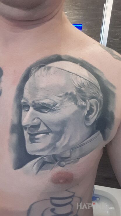 Tattoo Jan Pawel 2 in faces motif and realistic style on the chest