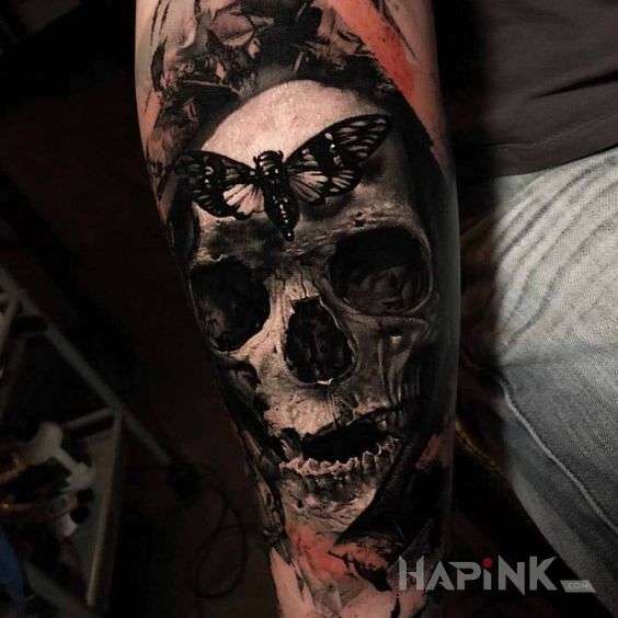 Tattoo Cykada in butterflies motif and realistic style on the forearm