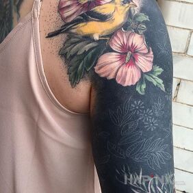 Tattoo Bird and flower on the upper arm motif: animals