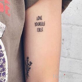 Tattoo Love on the upper arm motif: lettering