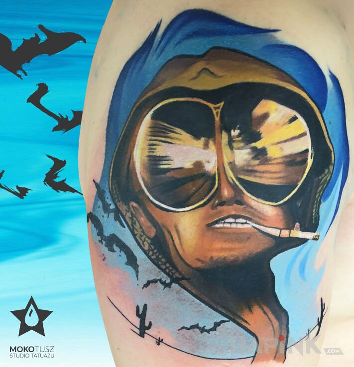 Tattoo Las Vegas Parano in faces motif on the upper arm
