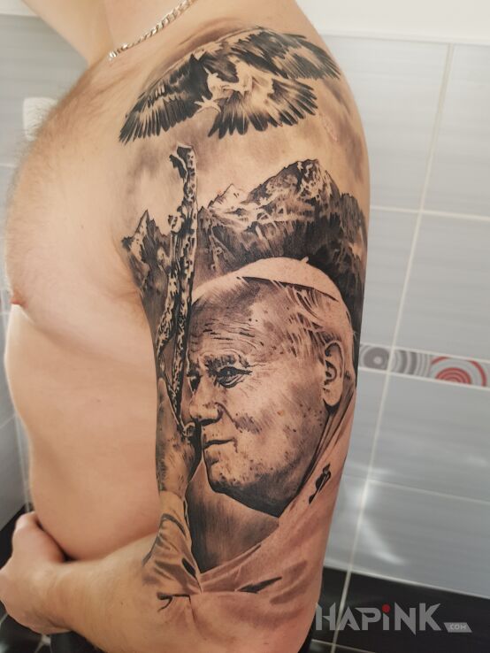 Tattoo Jan Pawel 2 in religious motif on the upper arm