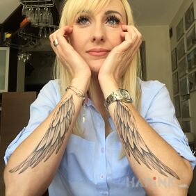 Tattoo Wings on the forearm motif: angels