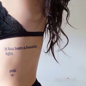 Tattoo Beautiful fight on the ribs motif: sexy