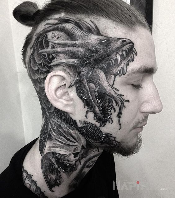 Tattoo Twarzowy wąż in demons motif on the neck