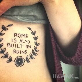 Tattoo Rome on the ribs motif: lettering