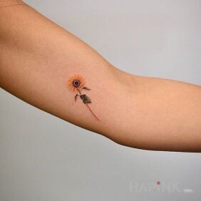 Tattoo Sunflower on the upper arm motif: colorful