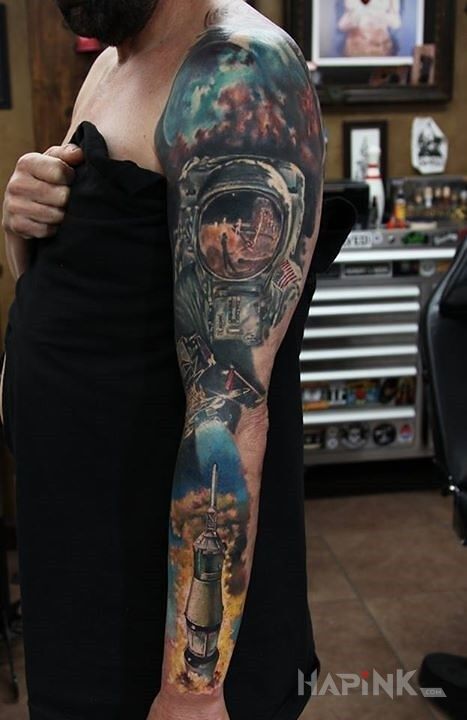 Tattoo NASA in 3D motif and realistic style on the forearm