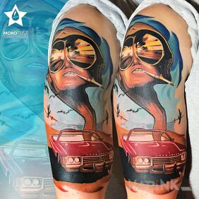 Tattoo Las Vegas Parano on the upper arm motif: colorful style: realistic